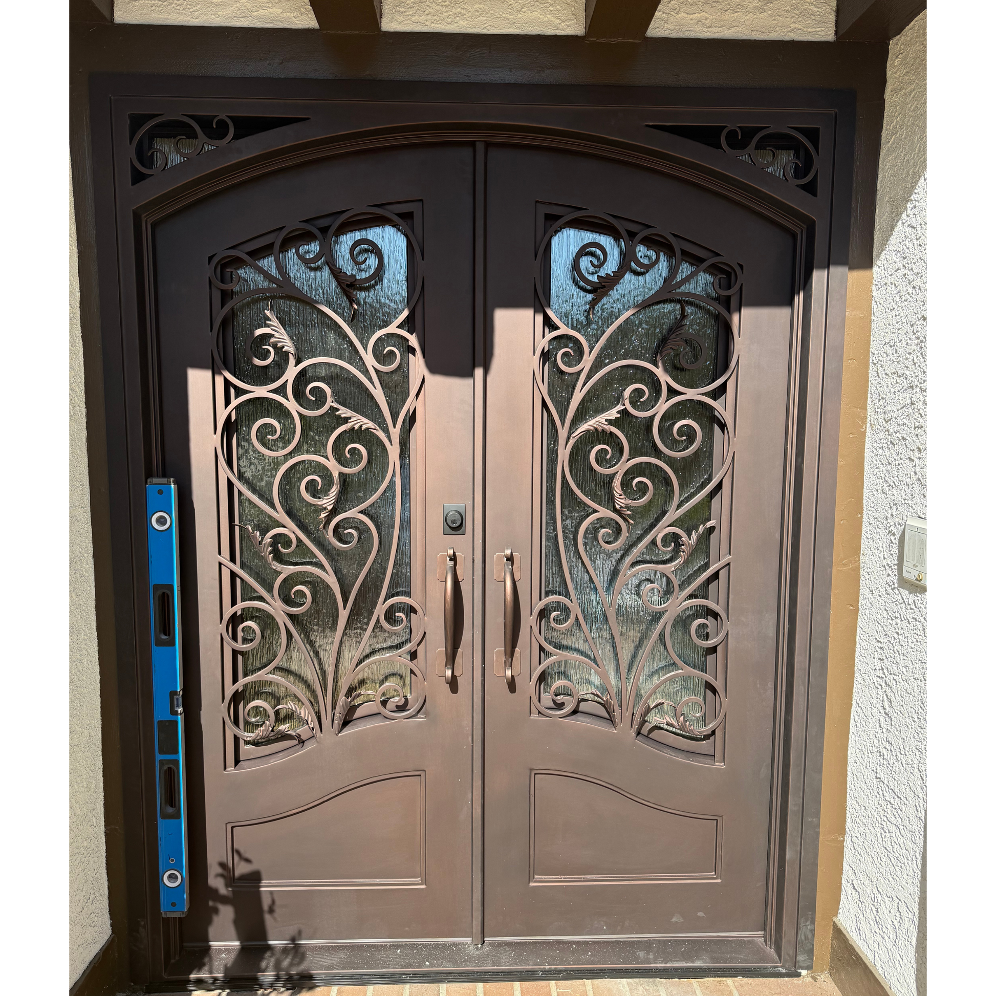 Black door with glass panel in a warehouse setting
