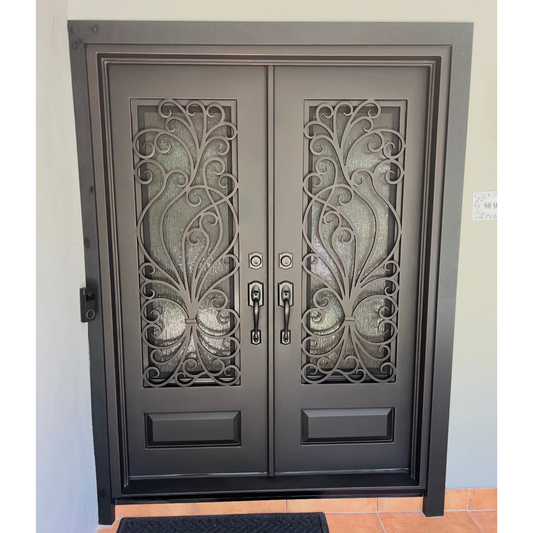 Decorative double door with metal grills on a light-colored wall.