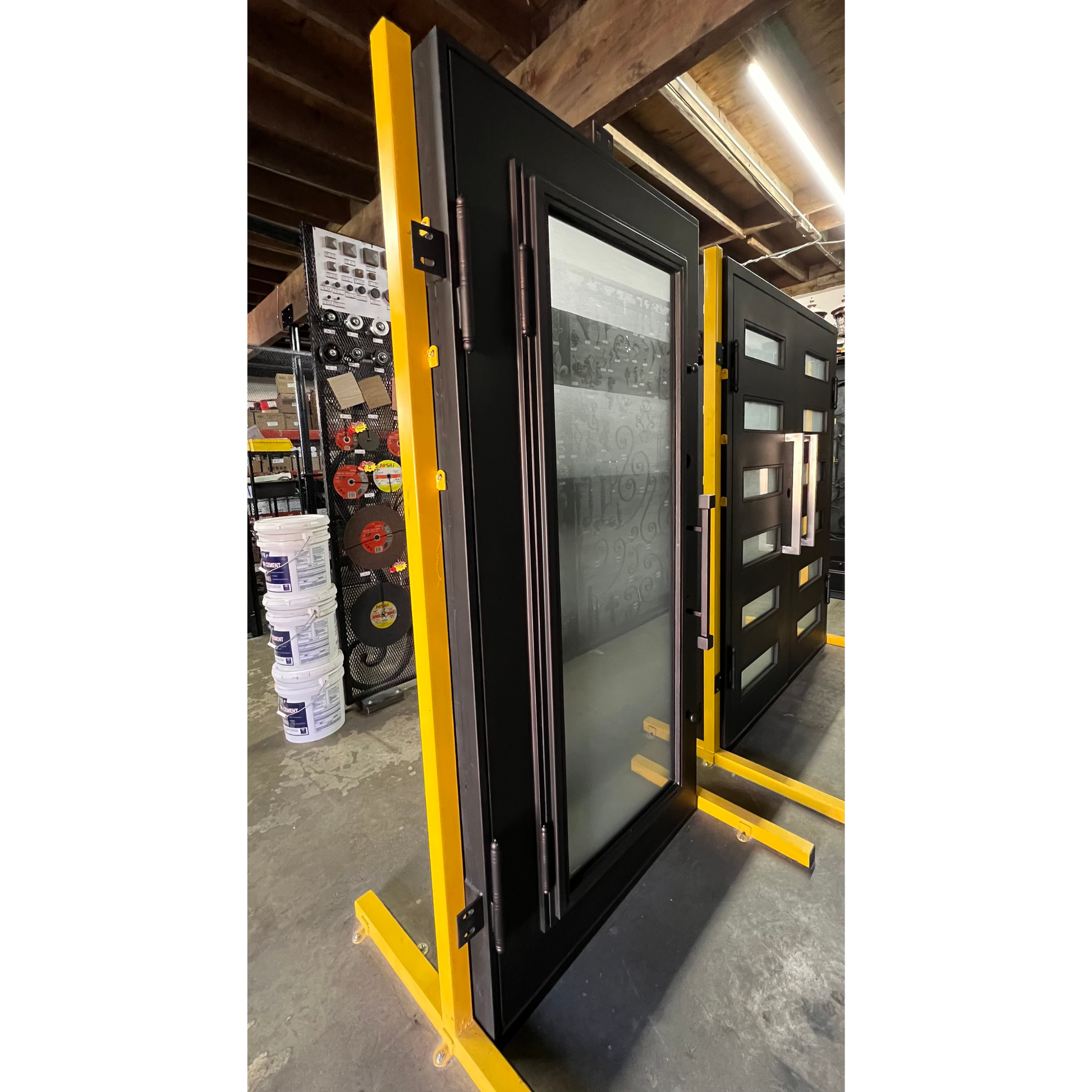 Window frame on a yellow stand in a warehouse setting