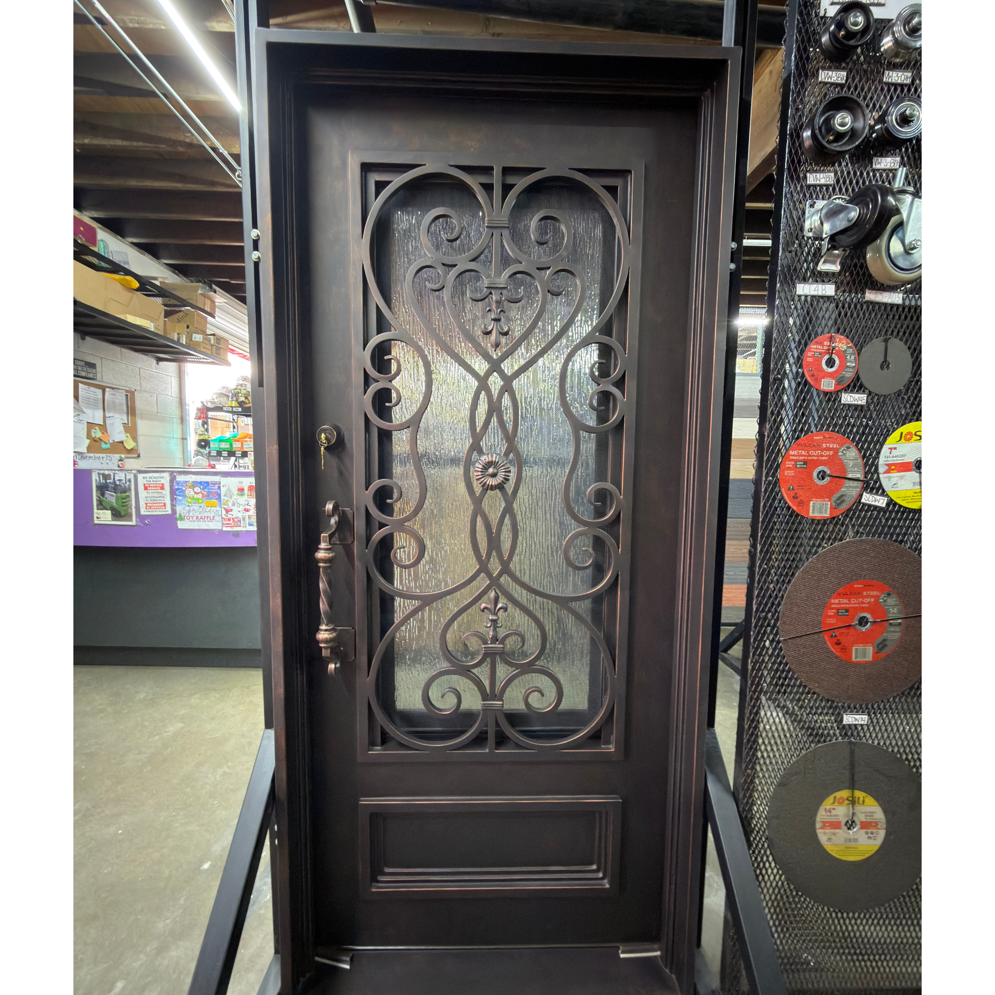 Decorative wrought iron door in a store setting with various products around